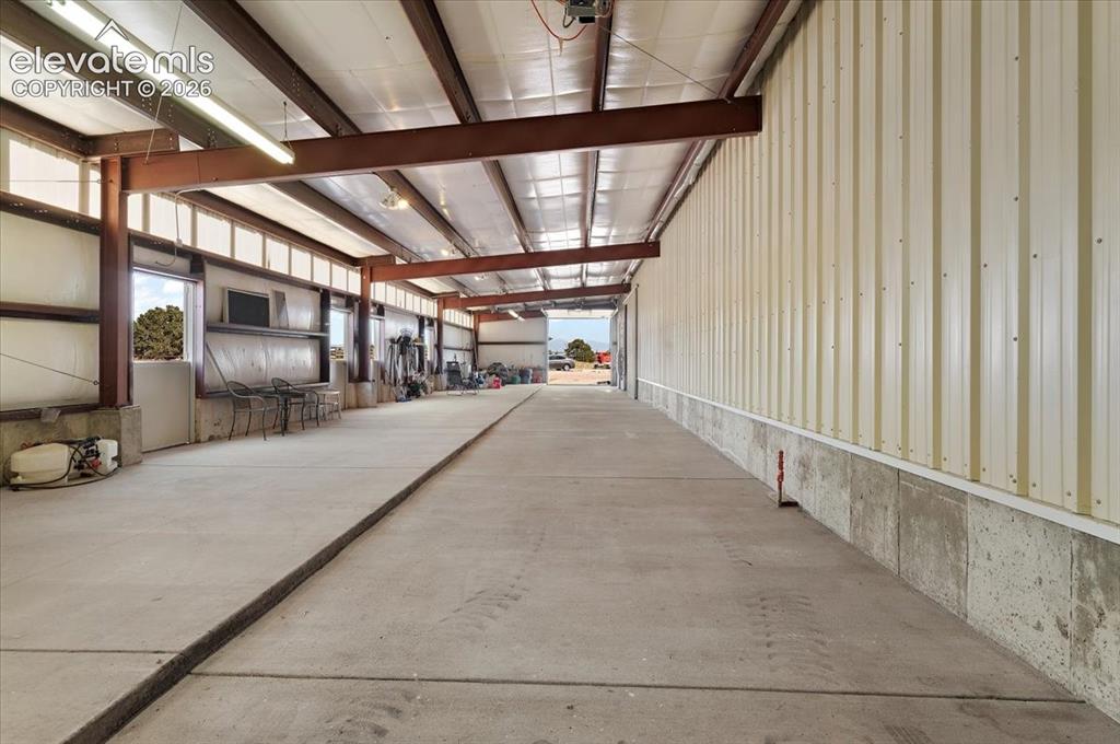 Image 29 of 50: View of stall area from other end of building. Stall doors all access the t
