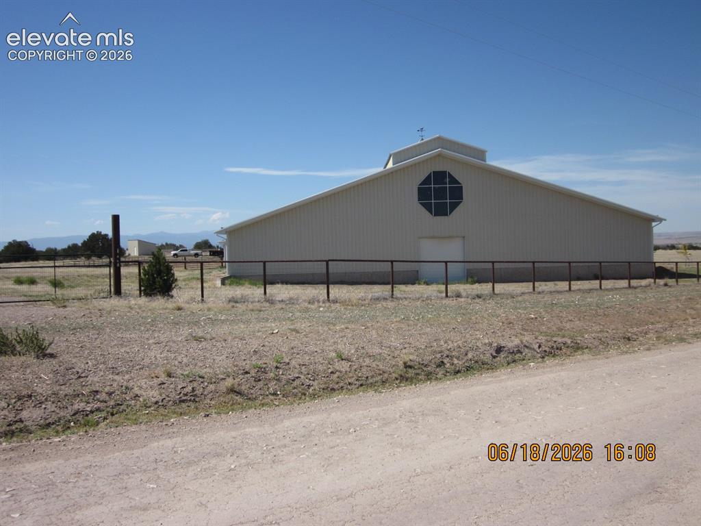 Image 3 of 34: West and south side of building.