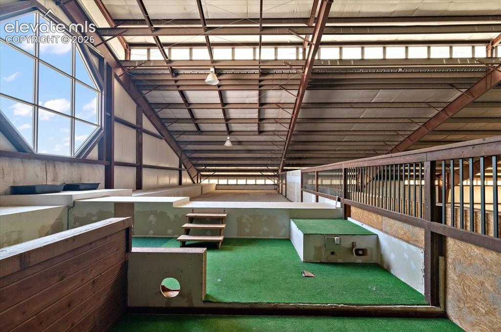 Image 35 of 50: Upper level overlooking tennis court and arena.