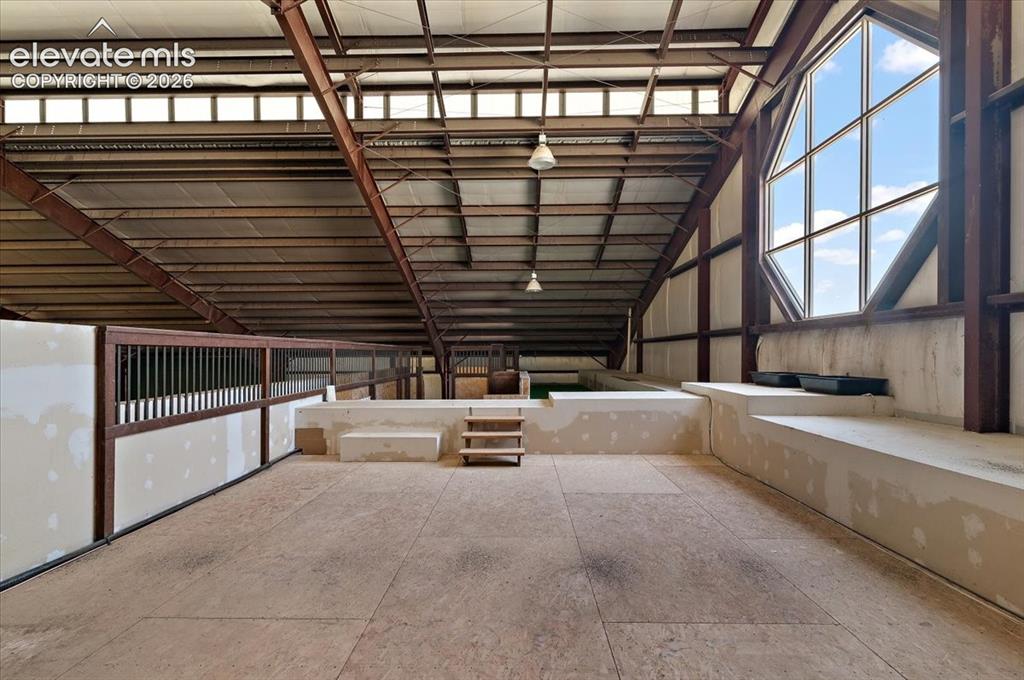 Image 36 of 50: Upper level overlooking tennis court and arena.