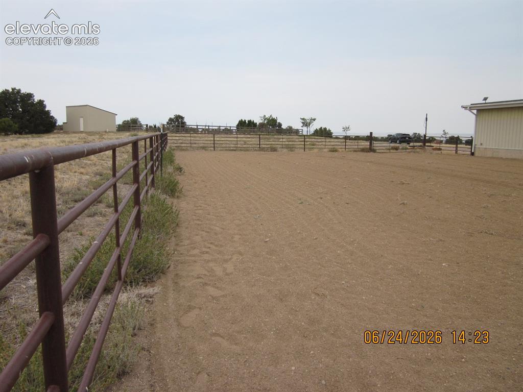 Image 5 of 34: South side of building. The property road frontage and part of the north s