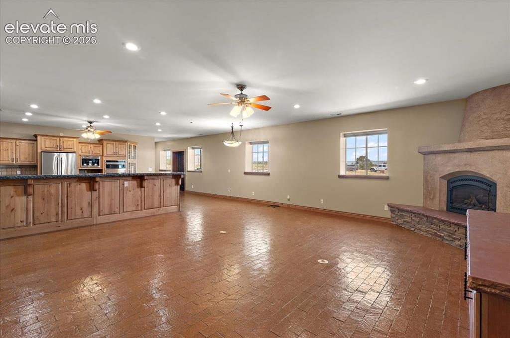 Image 9 of 50: Great room looking toward the kitchen and eating area.