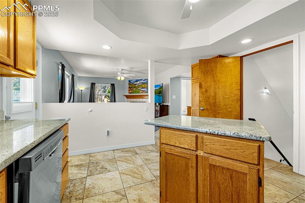 Image 11 of 42: Kitchen with ceiling fan, recessed lighting, stainless steel dishwasher, wo