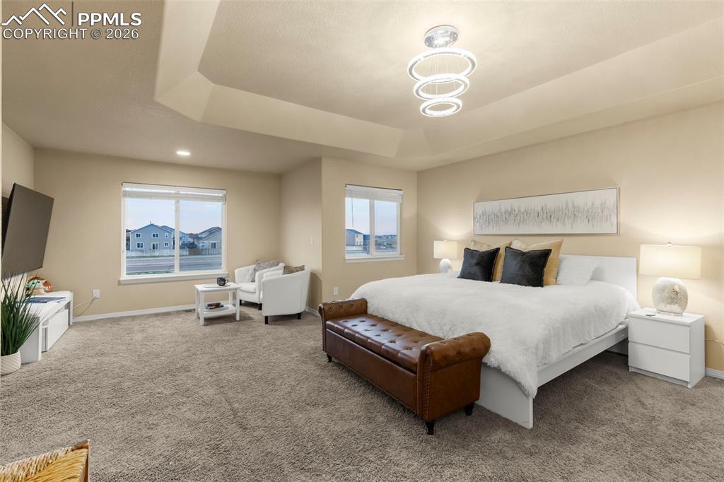 Image 32 of 50: Bathroom featuring vanity, shower / bath combo, a textured wall, recessed l