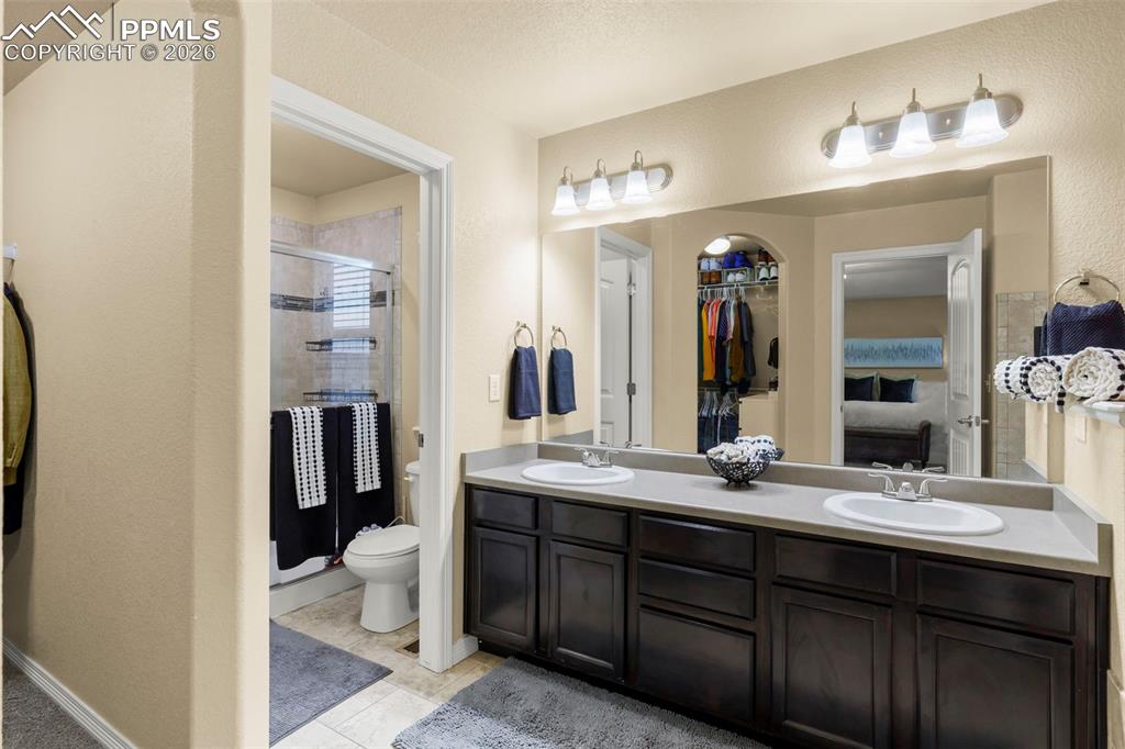 Image 33 of 50: Full bathroom featuring vanity, a shower with shower curtain, and light pat