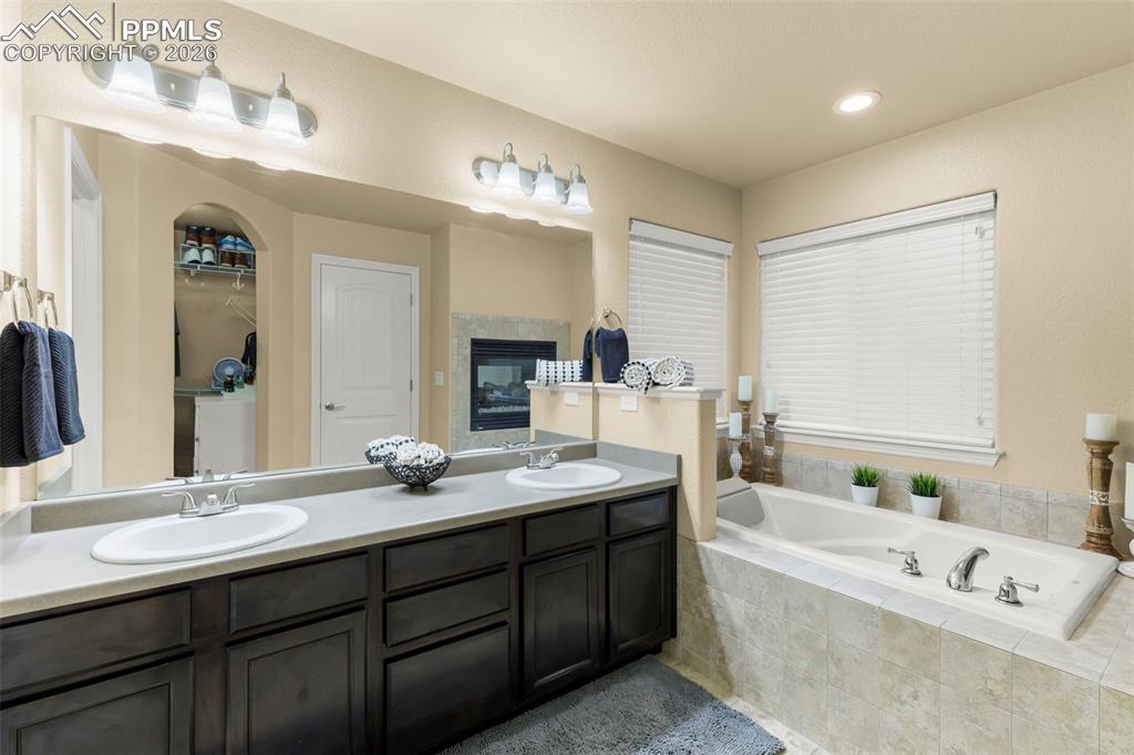 Image 34 of 50: Bedroom 2 with plenty of space, natural light, and a large closet
