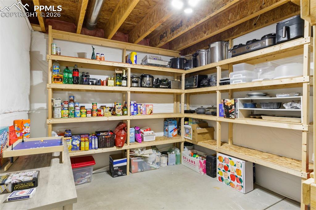 Image 37 of 50: Large primary bedroom with 2-sided fireplace 