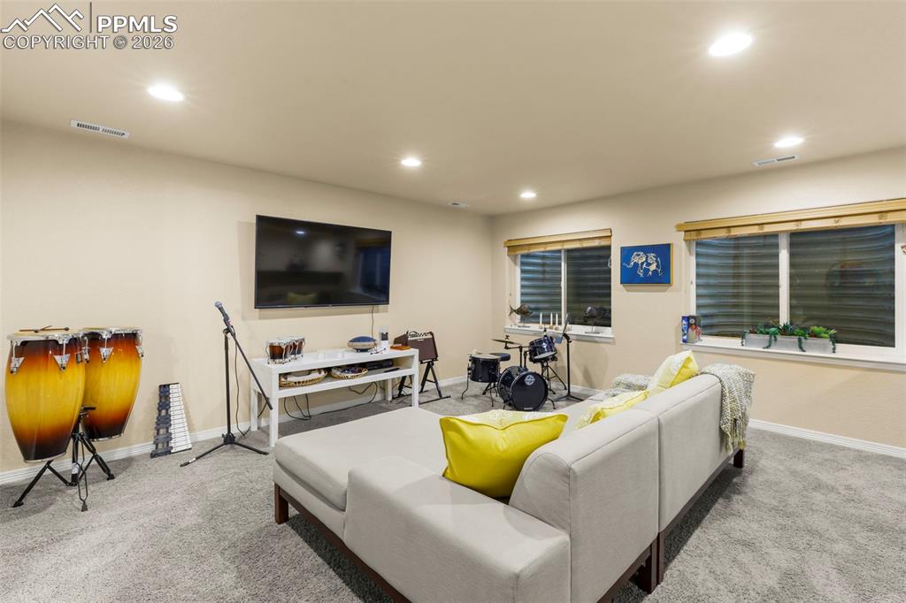Image 40 of 50: Large primary bedroom with a lot of natural light