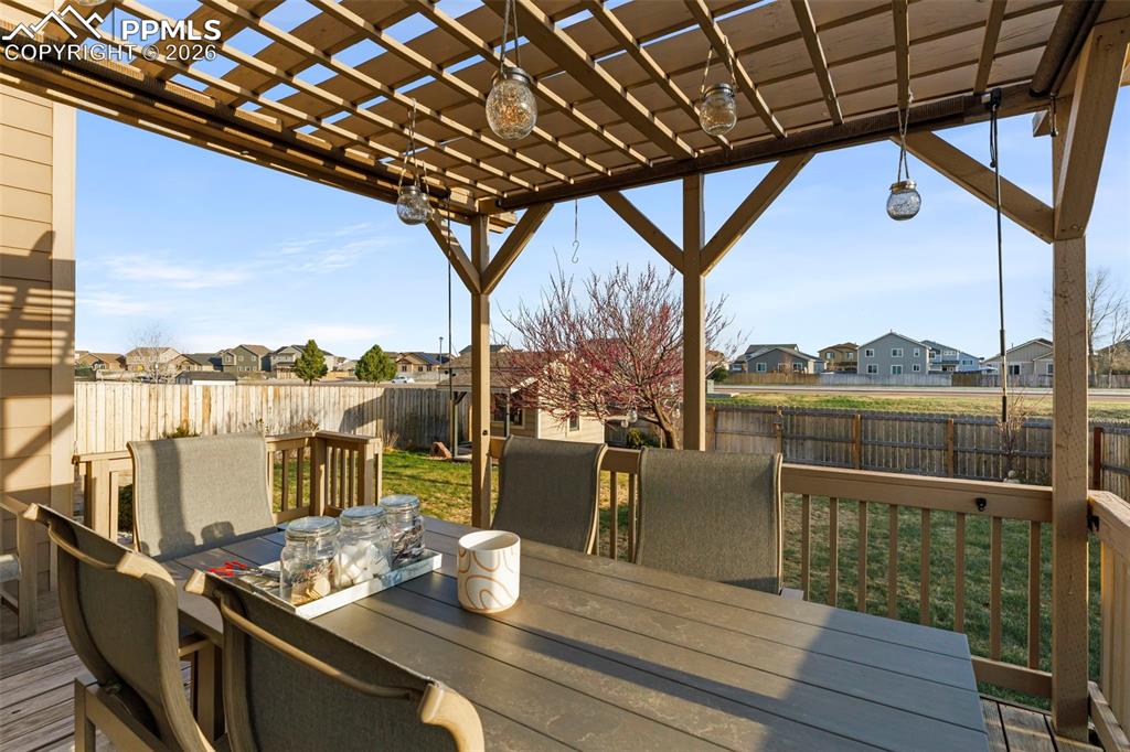 Image 47 of 50: Basement bar with lots of counter space and dark cabinets