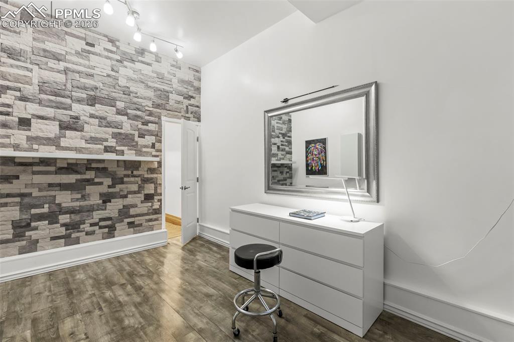 Image 49 of 50: Basement family room with a bar area