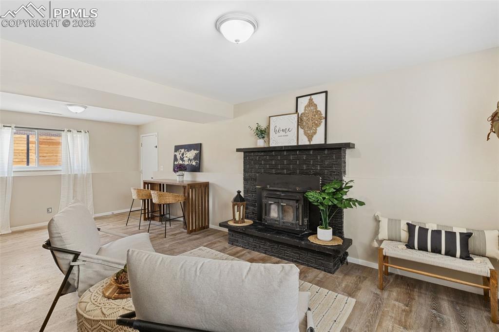 Image 19 of 38: Living room featuring wood finished floors and baseboards