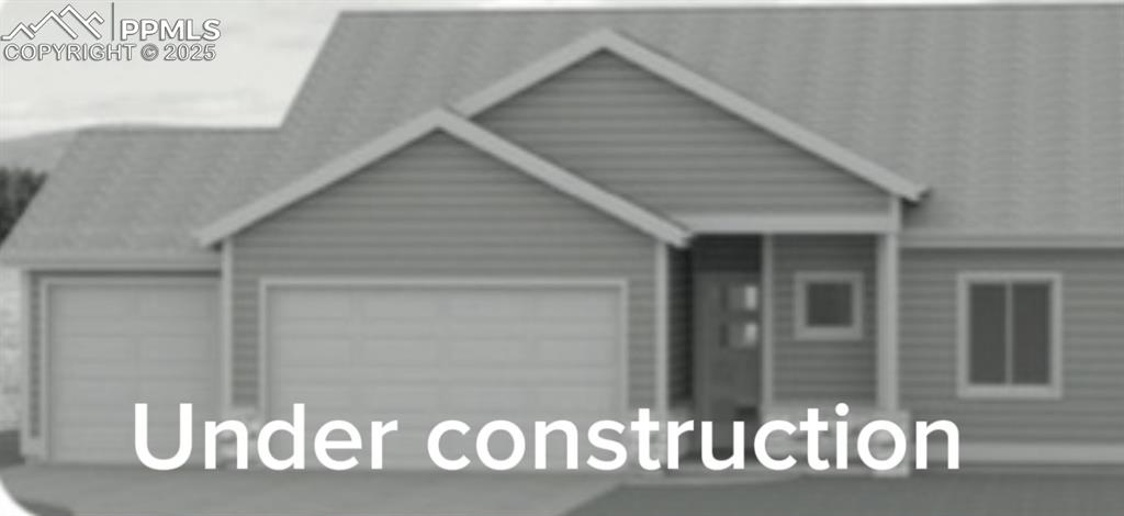 Caption: View of front of property with an attached garage