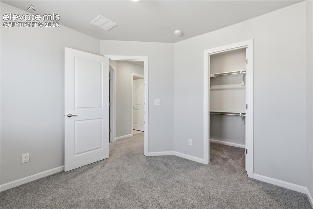 Image 29 of 42: Plush carpeted room featuring a neutral color palette, recessed lighting, a