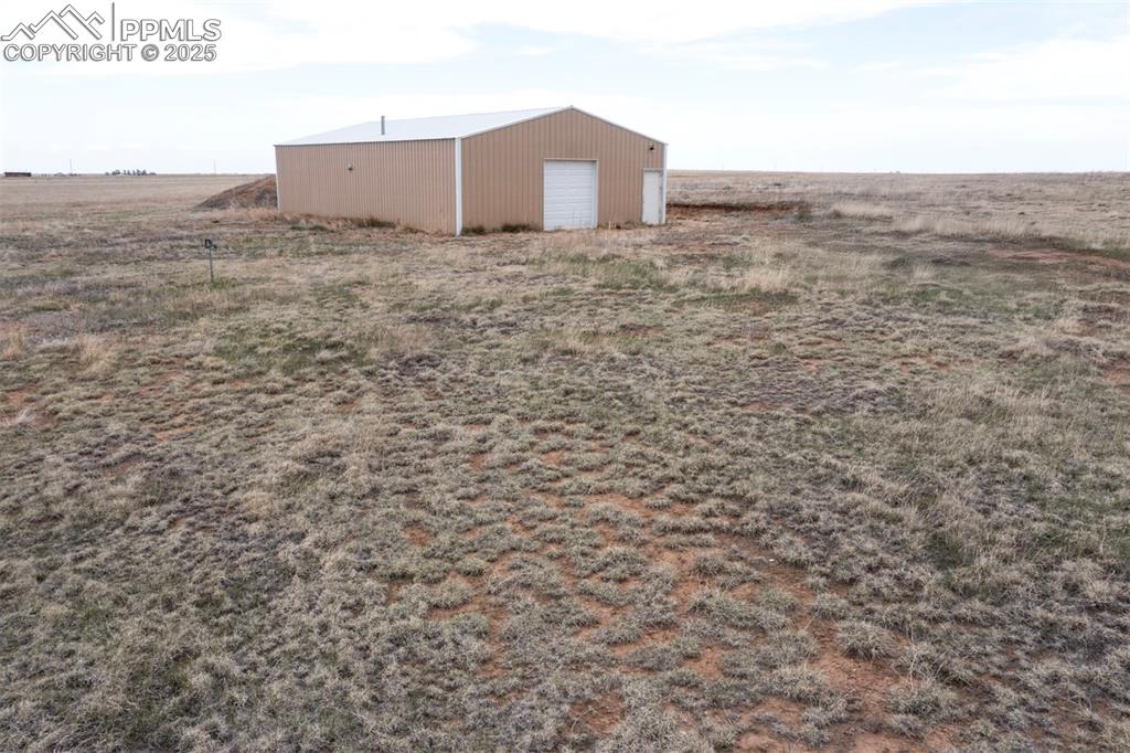 Image 30 of 30: View of front and side of 30 x 50 barn/garage/workshop