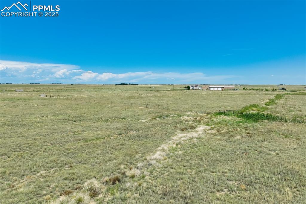 Image 16 of 25: View of green lawn with a rural view