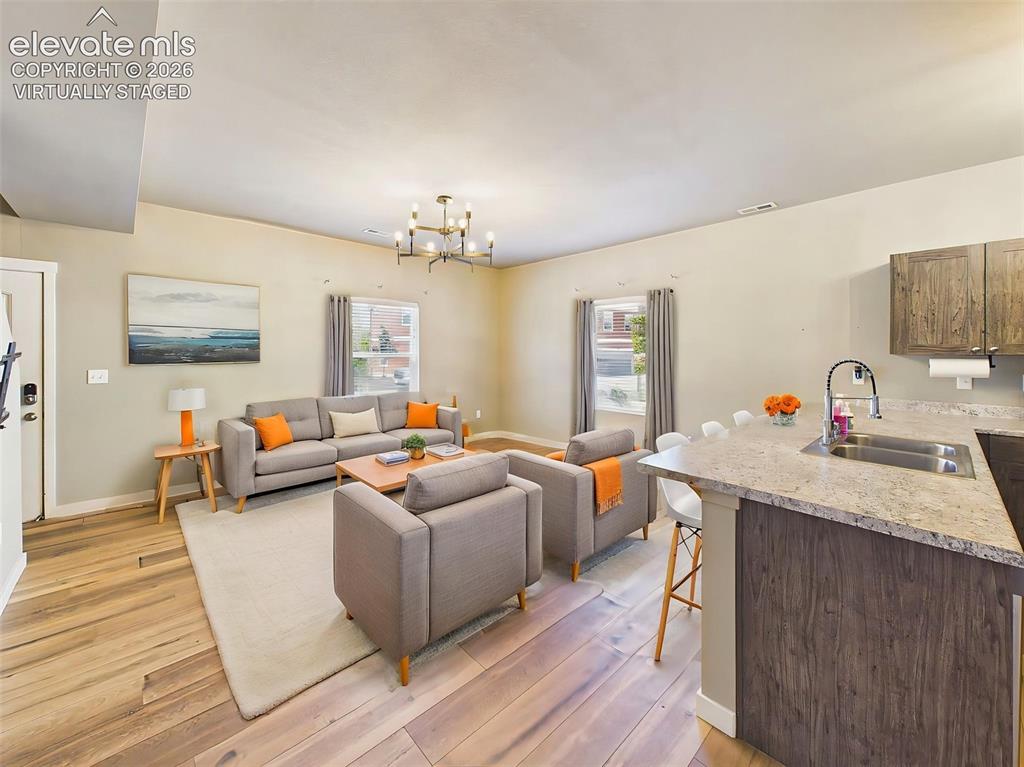 Image 11 of 40: (Virtually Staged) Inviting living room showcasing the open-concept design,