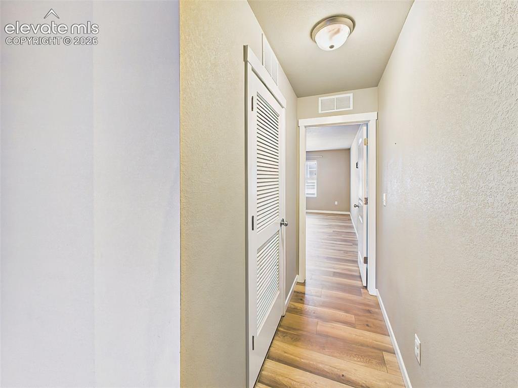 Image 15 of 40: Upper-level hallway providing access to the bedrooms, bathrooms, and laundr