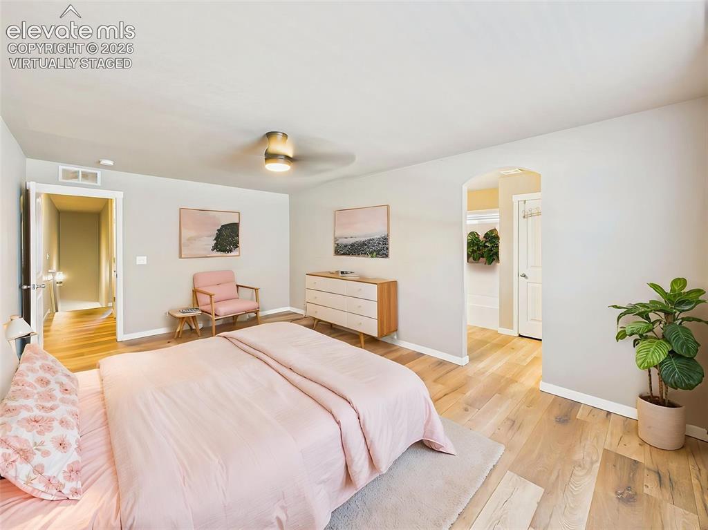 Image 19 of 40: (Virtually Staged) Expansive primary bedroom showcasing flexible furniture 