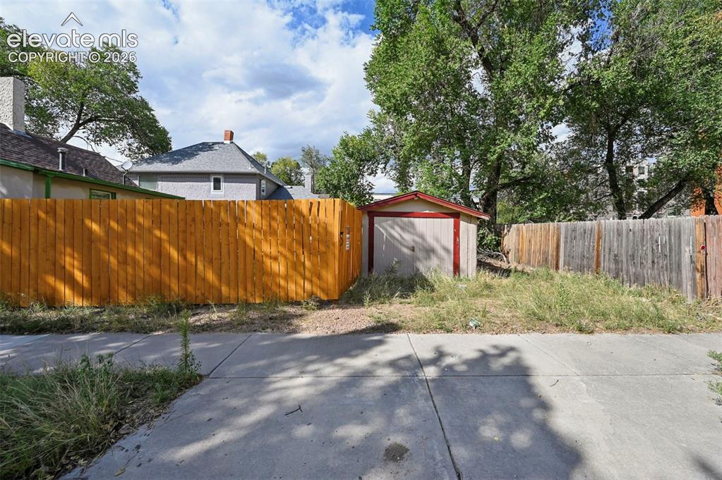Image 21 of 22: You could easily put in an ADU in the back of this home. 