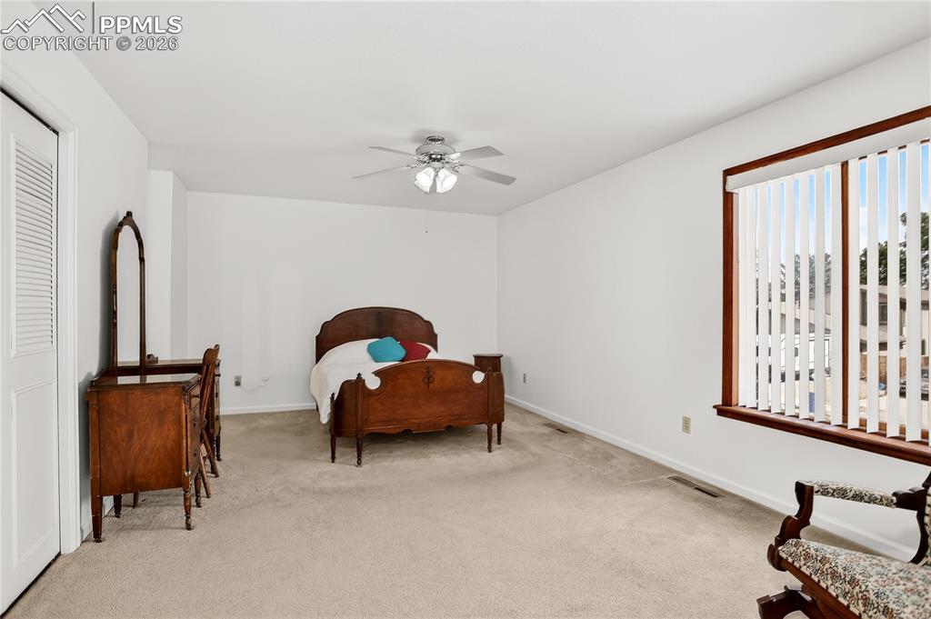 Image 22 of 37: Another view of primary bedroom.