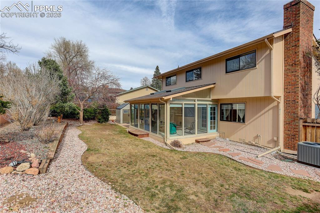 Image 29 of 37: Fully landscaped and fenced backyard