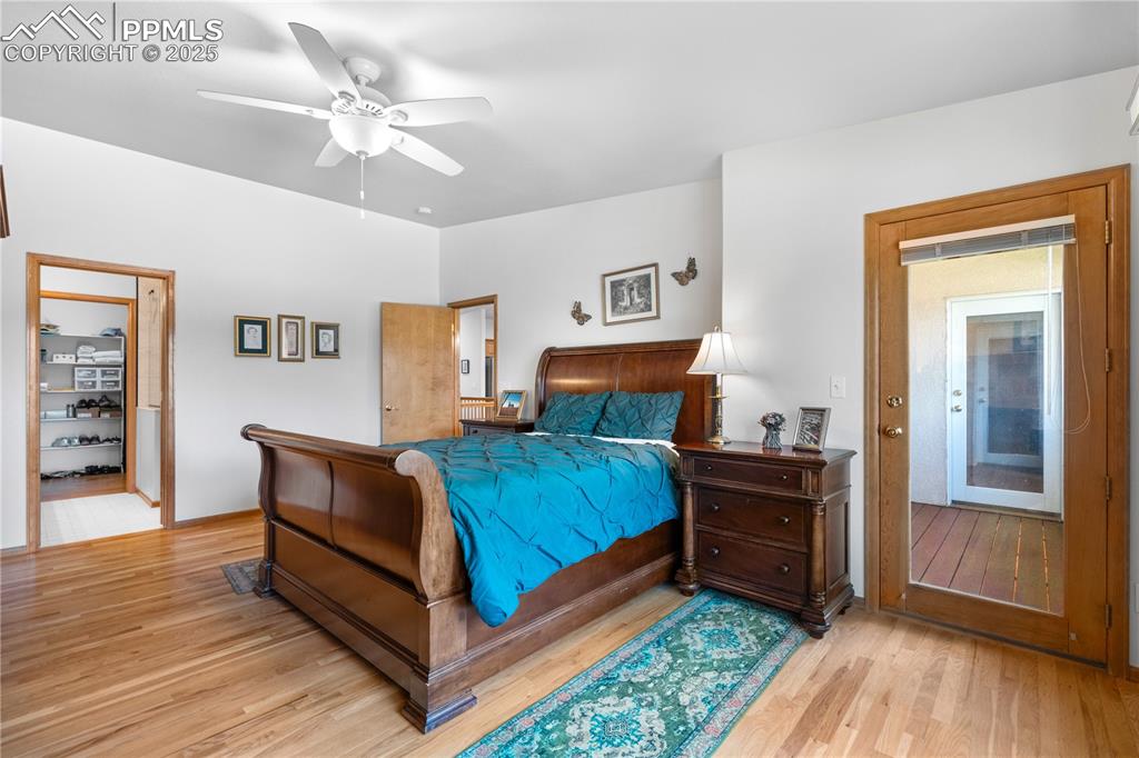 Image 23 of 49: Bedroom featuring light wood-style floors and a ceiling fan