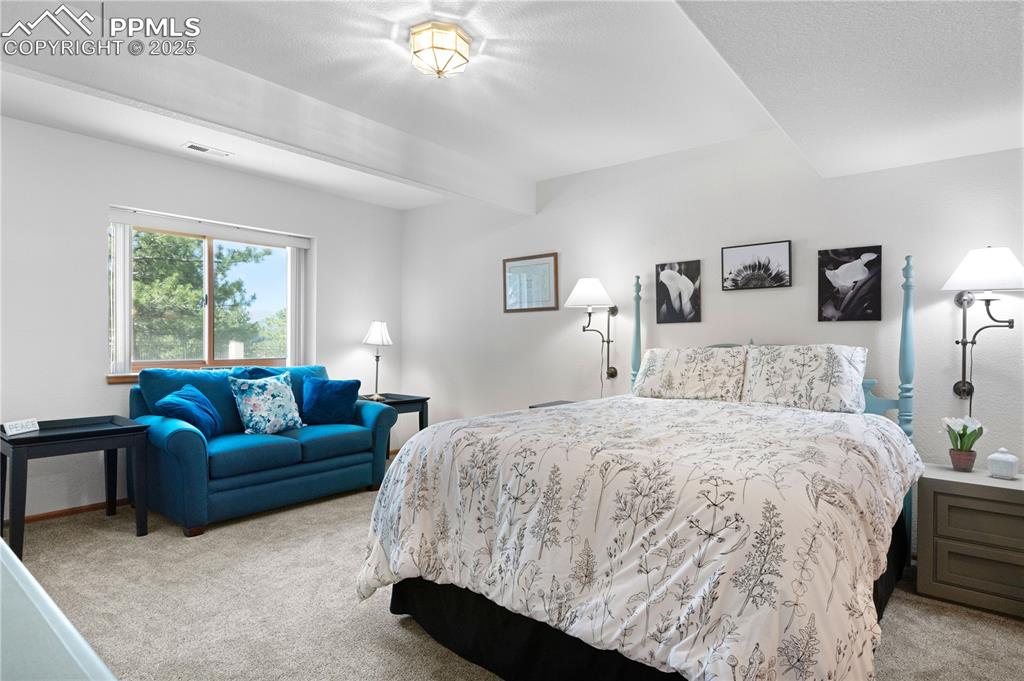 Image 33 of 49: Carpeted bedroom featuring baseboards