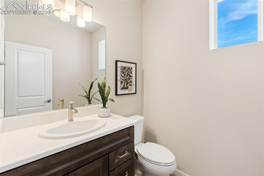 Image 18 of 40: Half bath off living room