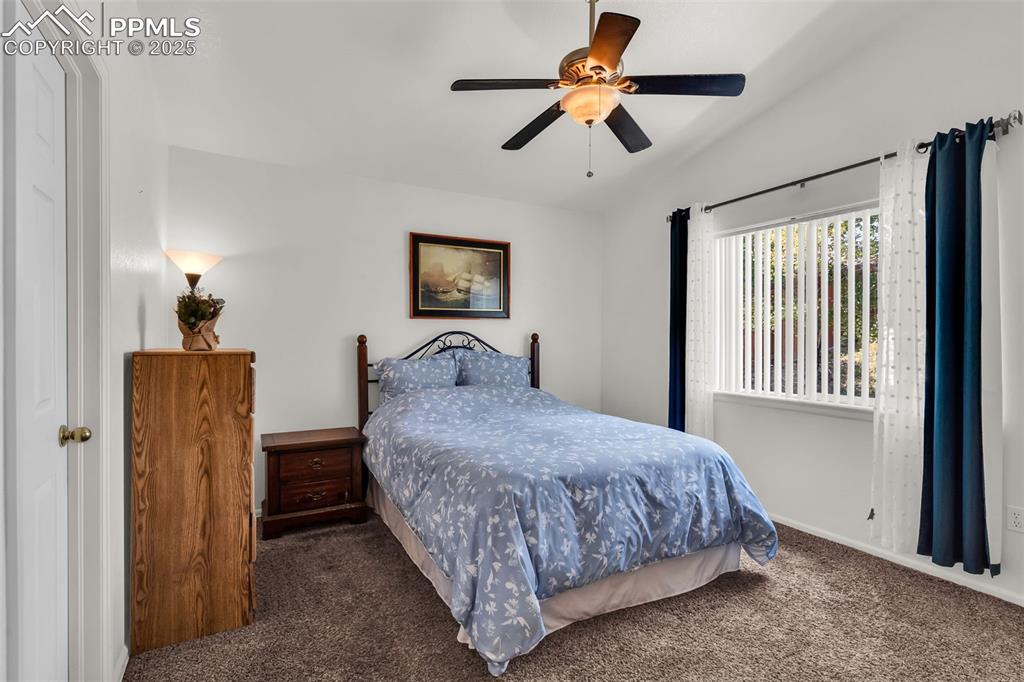 Image 11 of 20: Carpeted bedroom featuring a ceiling fan