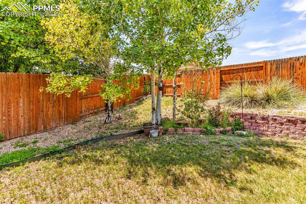 Image 16 of 20: View of fenced backyard