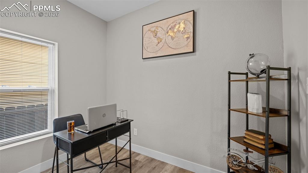 Image 12 of 36: Office space featuring light wood-style flooring and baseboards