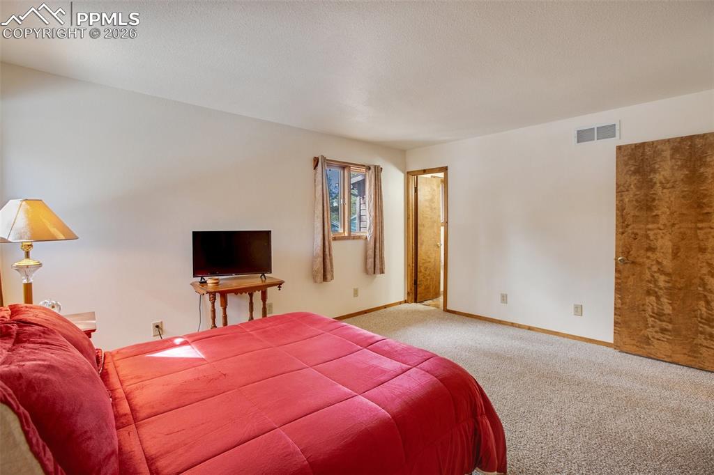Image 18 of 28: Master Bedroom