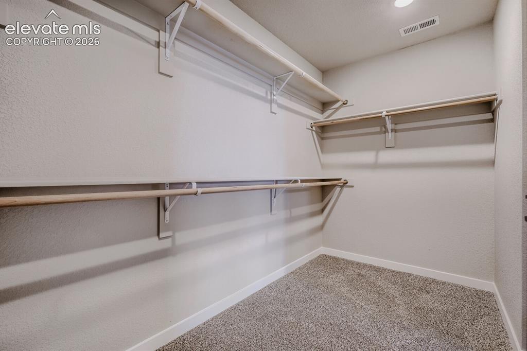 Image 19 of 29: Primary walk in closet