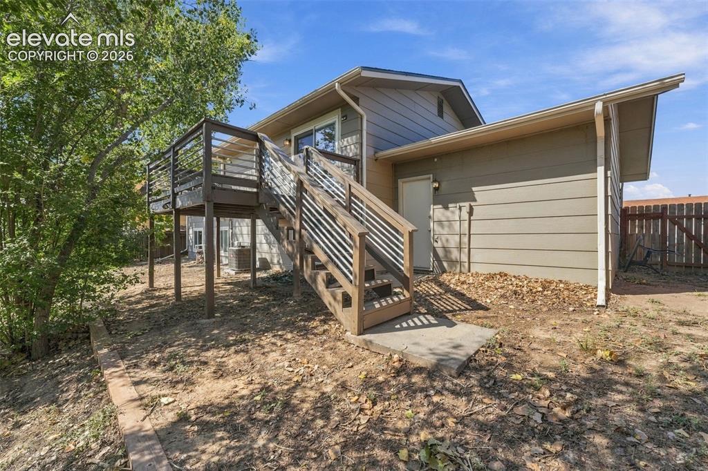 Image 36 of 46: Wood-finish elevated deck with horizontal railing