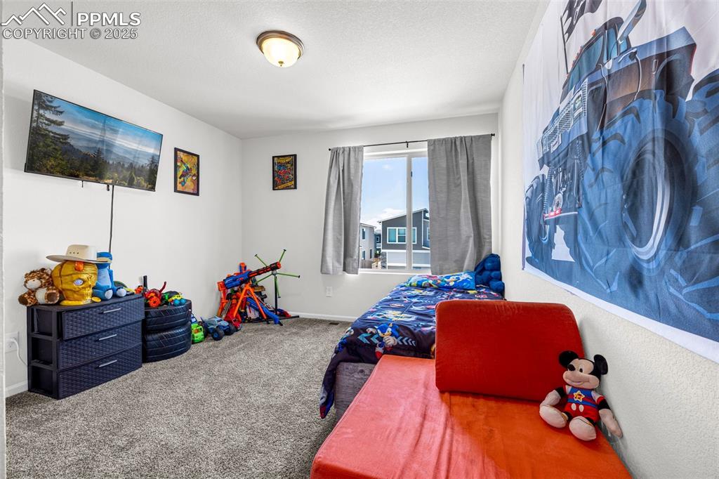 Image 14 of 35: Bedroom featuring carpet floors and baseboards