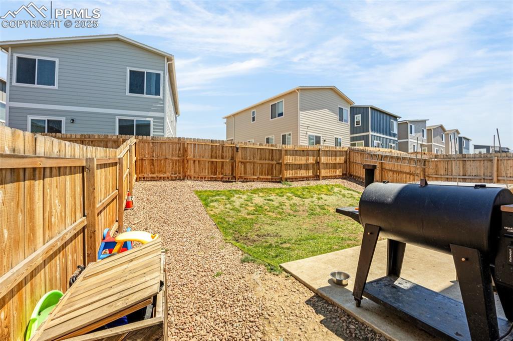 Image 26 of 35: Fenced backyard featuring a residential view