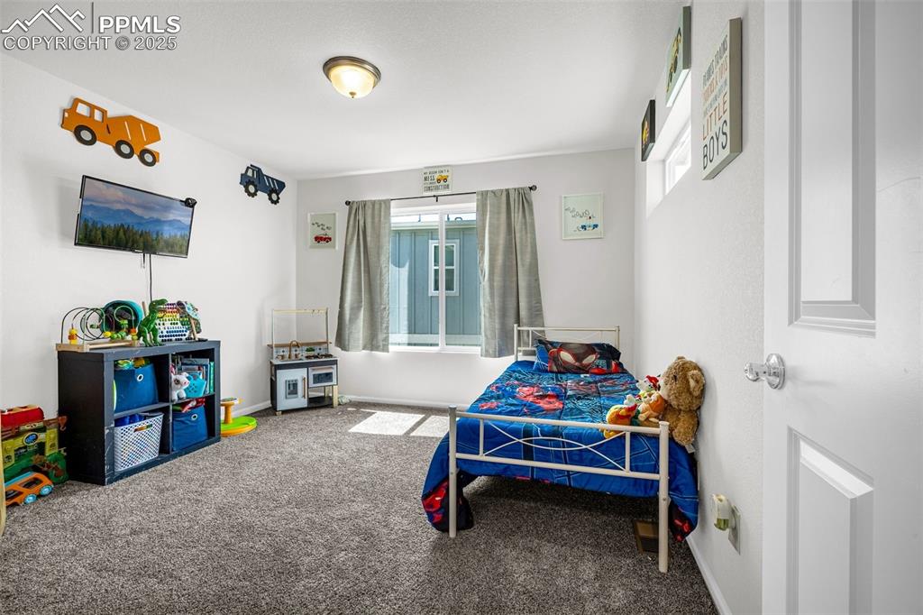 Image 3 of 35: Bedroom featuring carpet floors and baseboards