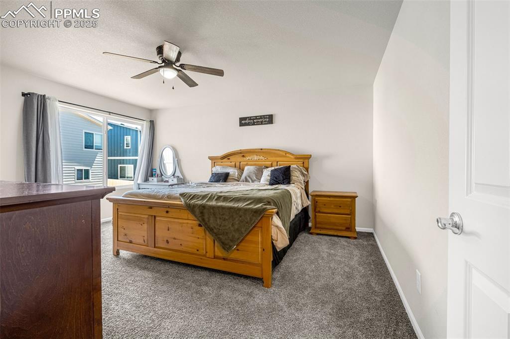 Image 7 of 35: Bedroom with carpet floors and ceiling fan