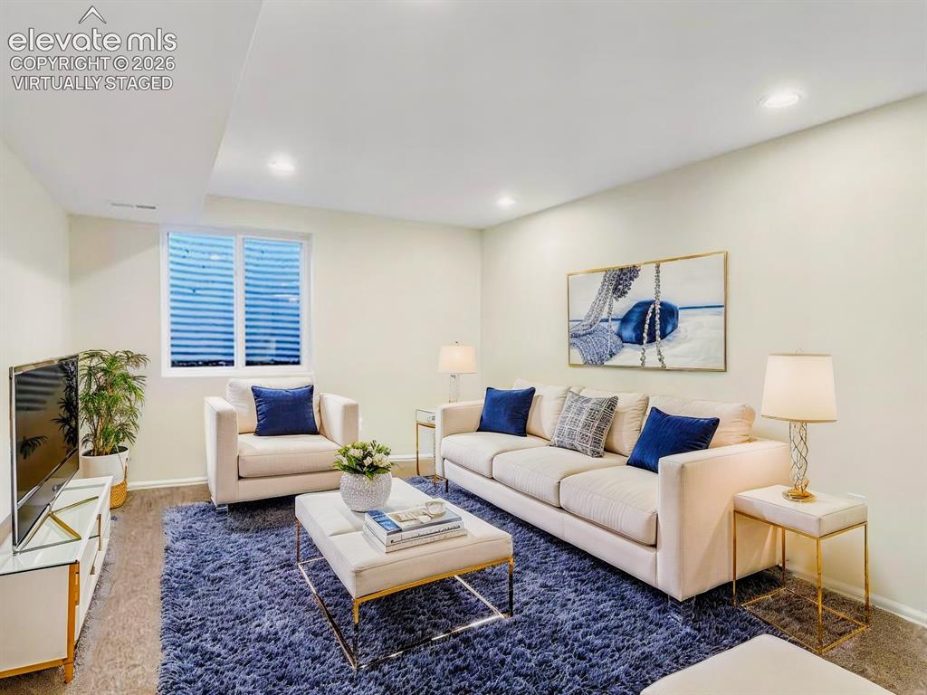 Image 39 of 44: Virtually Staged Open-concept living area featuring recessed lighting, a wi