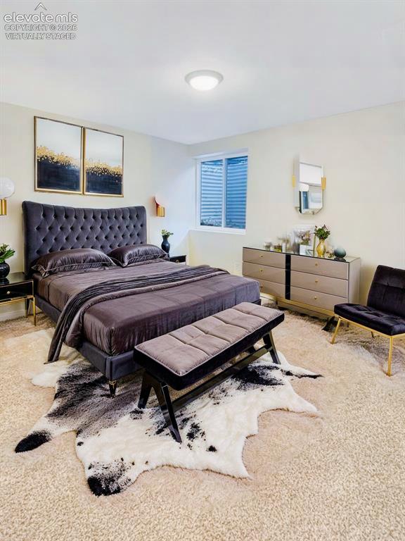 Image 41 of 44: Virtually Staged Carpeted bedroom with a built-in window and overhead light