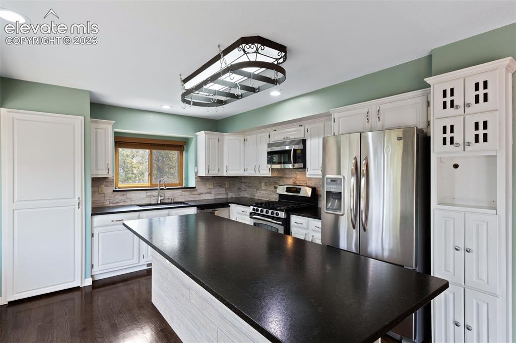 Image 12 of 50: Stainless Appliances / Wine Fridge