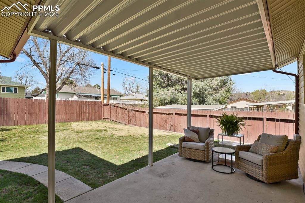 Image 35 of 40: Covered back patio
