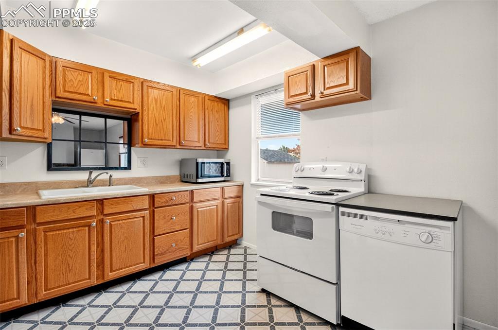 Image 18 of 37: Another kitchen view with portable dishwsher