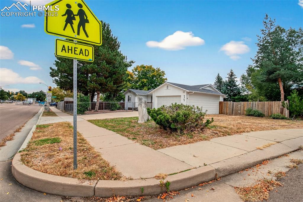 Image 27 of 37: View of front of house with a garage and culdesac parking