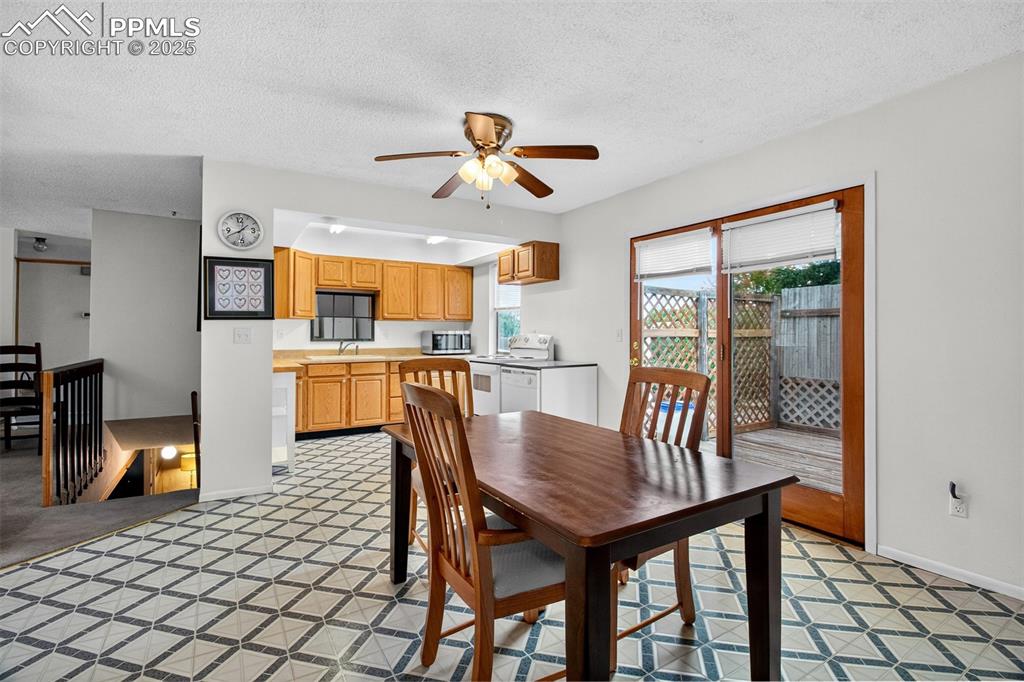 Image 4 of 37: Dining area with walk out to rear deck