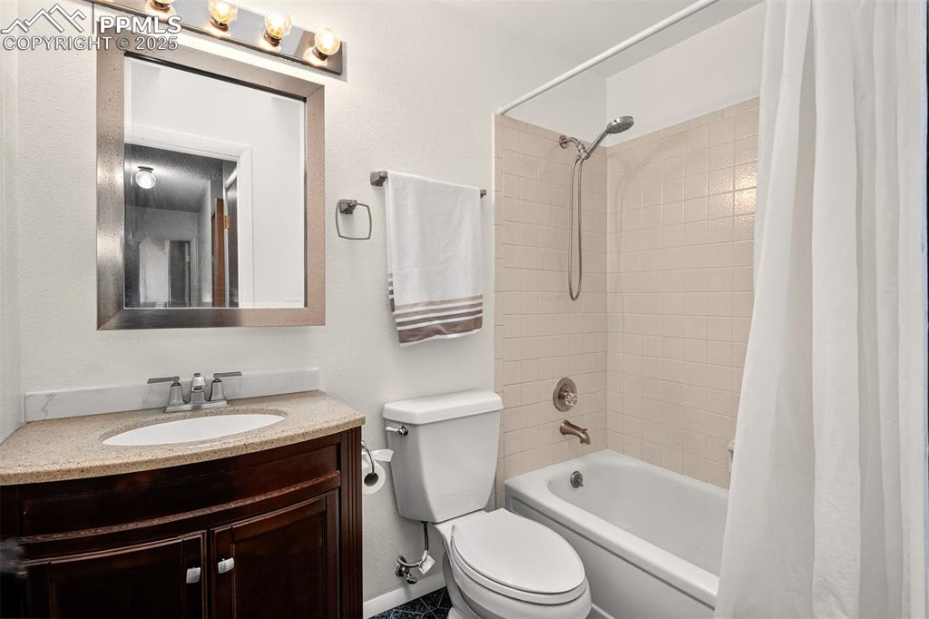 Image 6 of 37: Full bathroom on the main with shower/bath combo