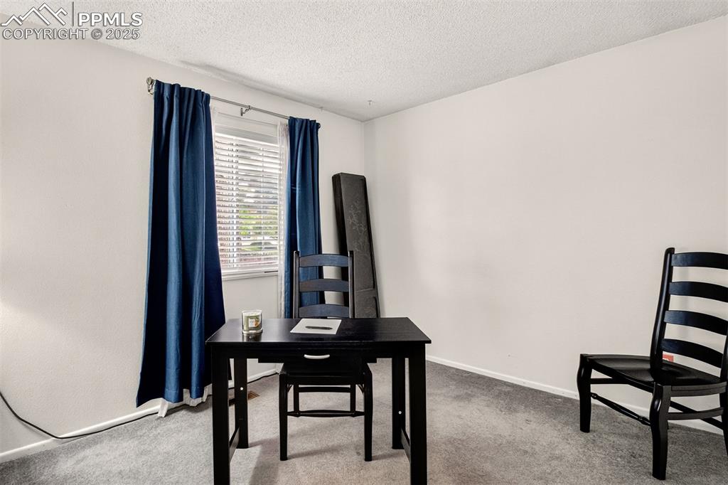 Image 7 of 37: Carpeted office featuring a textured ceiling and baseboards