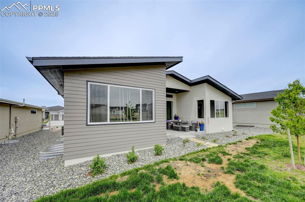 Image 46 of 48: Rear view of property featuring a patio