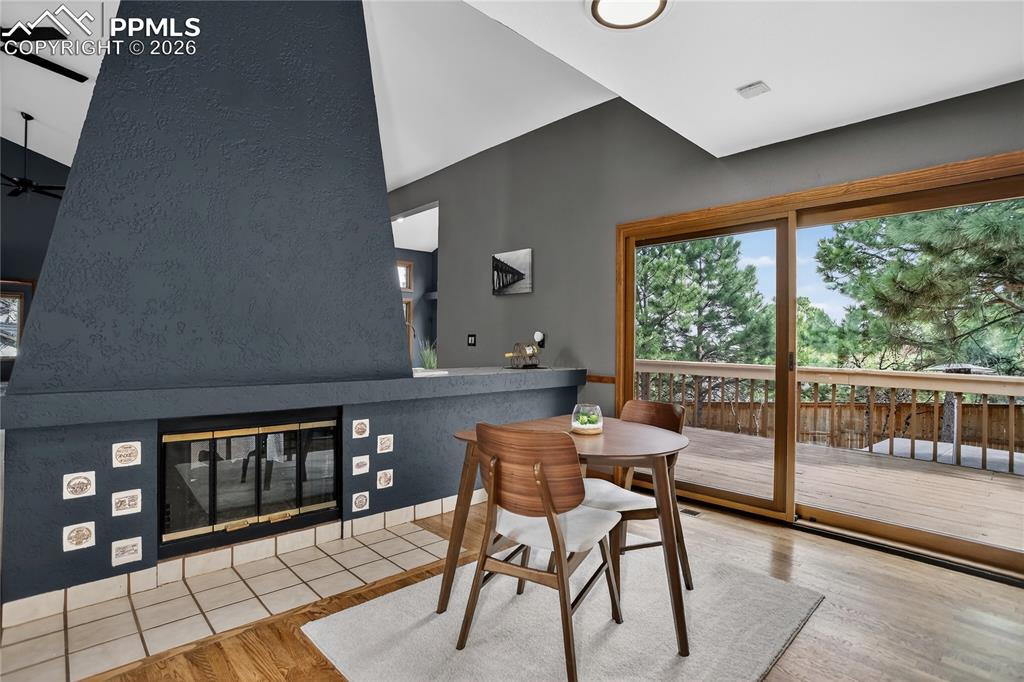 Image 11 of 42: Dining area w/ walk-out