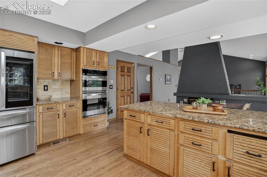 Image 13 of 42: SS appliances including dual ovens